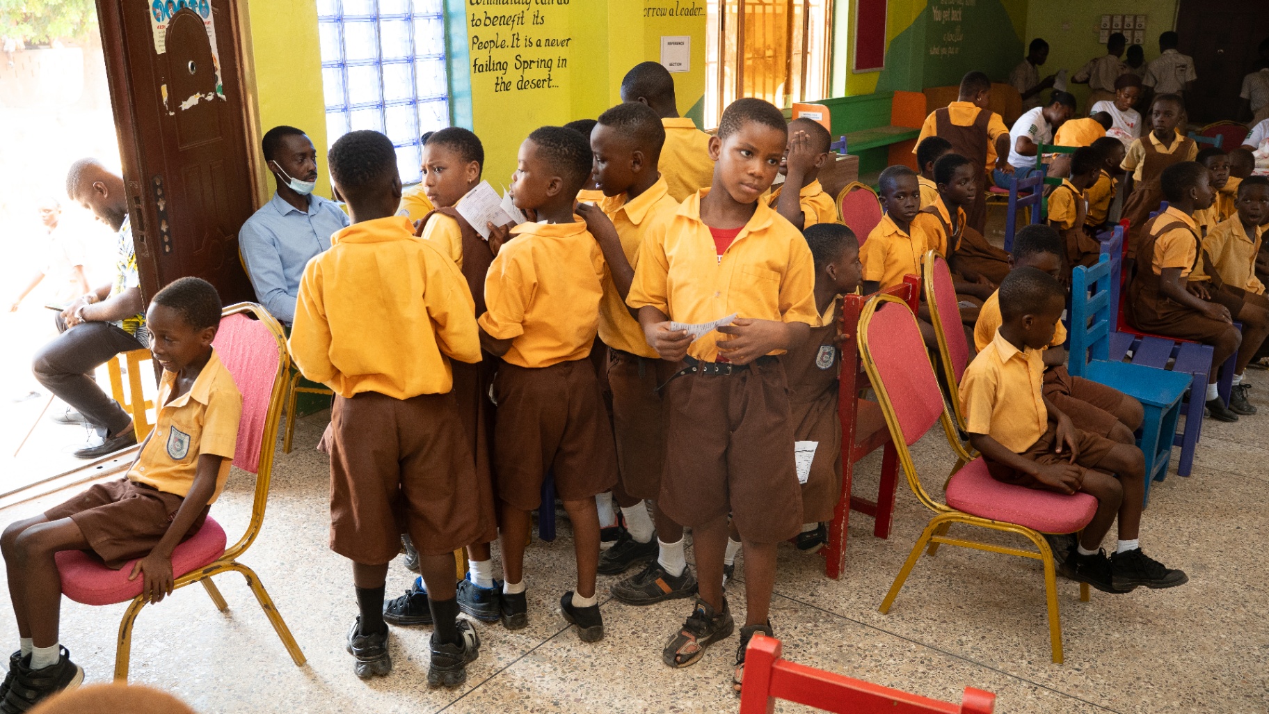 Schoolchildren lining up for screening and care